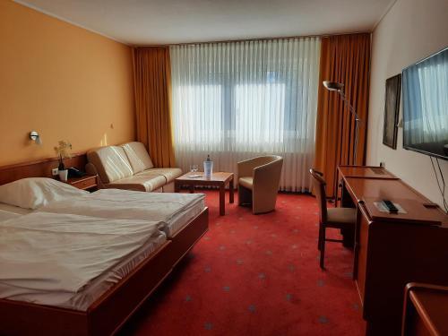 Foto de una habitación de AVALON Hotelpark Königshof