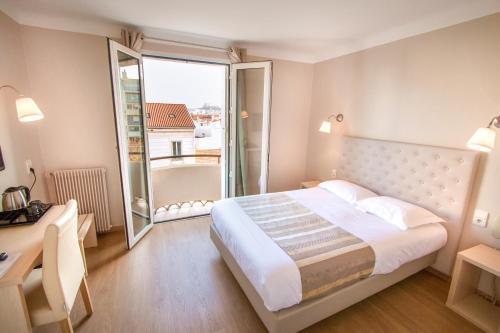Foto de una habitación de Hôtel Mondial