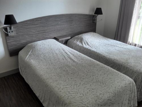 Foto de una habitación de Acqs Hôtel
