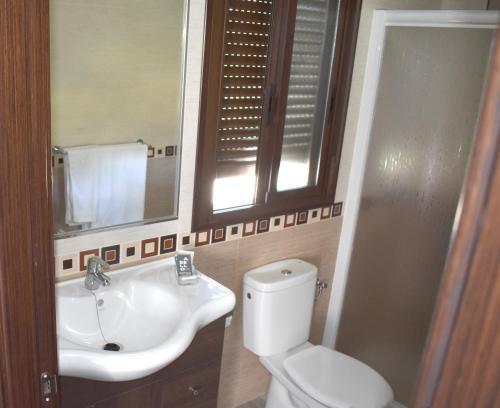 Foto de una habitación de Iznájar Suites