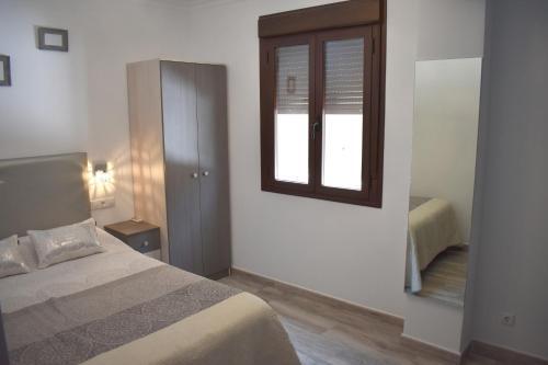 Foto de una habitación de Iznájar Suites