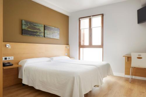 Foto de una habitación de Hotel Olatu
