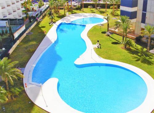 Foto de una habitación de Alquileres Vacacionales Gemelos 26-T2-27-C