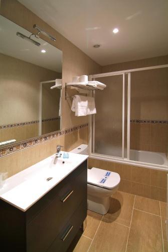 Foto de una habitación de Apartahotel La Corrala