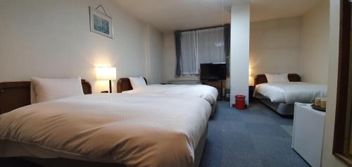 Foto de una habitación de Kokoro Hotel Hakuba