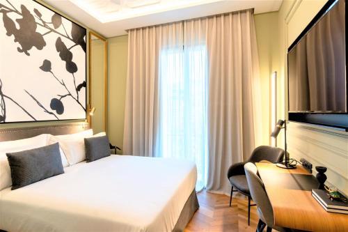Foto de una habitación de Hotel L&amp;amp;H Gran Vía Valencia
