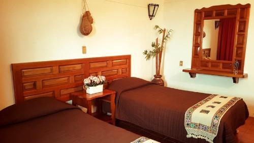 Foto de una habitación de Hotel Meson Yohualichan