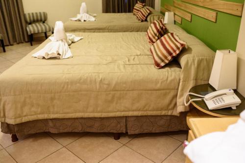Foto de una habitación de AVEMAR Apart Hotel