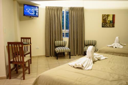 Foto de una habitación de AVEMAR Apart Hotel