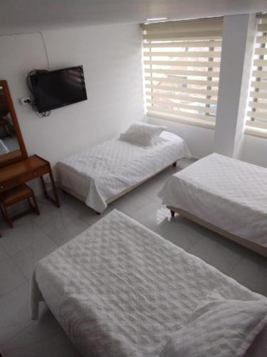 Foto de una habitación de HOTEL ZUHE