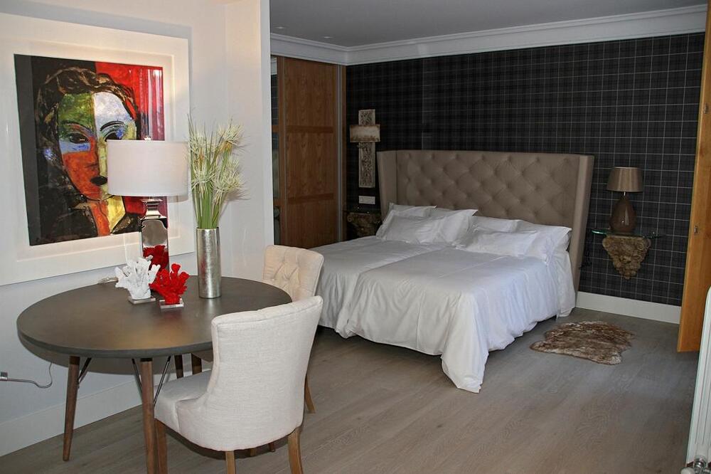 Foto de una habitación de Apartamentos Principia Suites