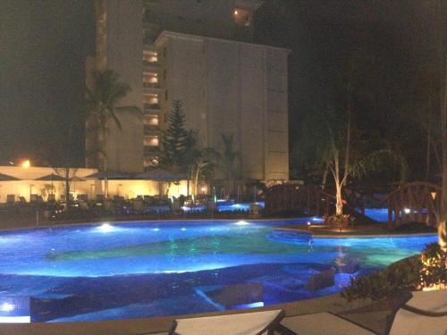 Foto de una habitación de Aparthotel The Palms Ocean Club Resort