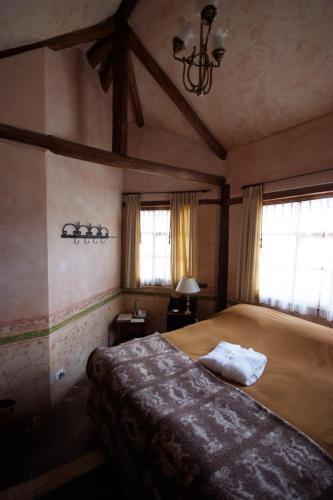 Foto de una habitación de Hotel Hacienda San Agustin de Callo