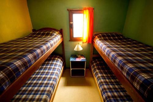 Foto de una habitación de Lago Argentino Hostel