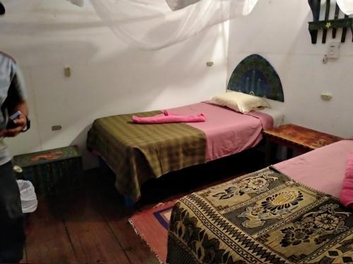 Foto de una habitación de Hotel La Casa Rosada