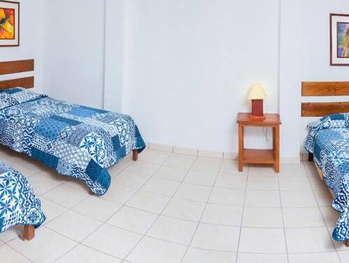 Foto de una habitación de Hotel Cocos Inn