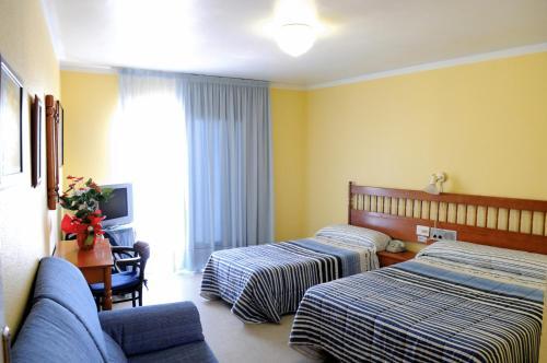 Foto de una habitación de Hotel Plaça Vella