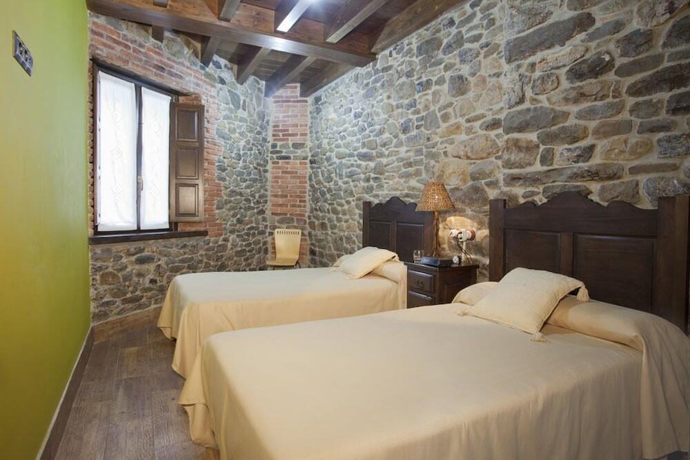 Foto de una habitación de Apartamentos El Aramo Asturias