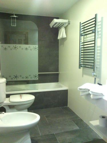 Foto del baño de Hotel Apolo