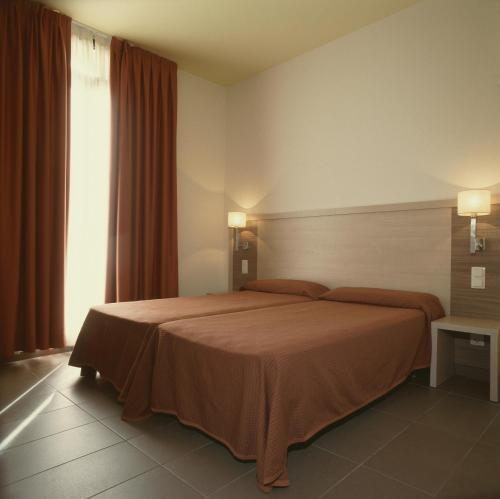 Foto de una habitación de Hotel Residència Erasmus Gracia