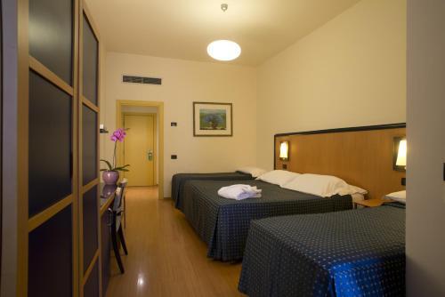 Foto de una habitación de Hotel Masini