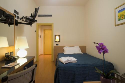 Foto de una habitación de Hotel Masini