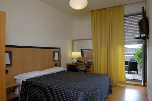 Foto de una habitación de Hotel Masini