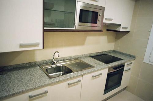 Foto de una habitación de Apartamentos Auhabitat Zaragoza, edificio de apartamentos turísticos con facilidad de parking