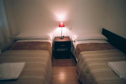 Foto de una habitación de Apartamentos Auhabitat Zaragoza, edificio de apartamentos turísticos con facilidad de parking