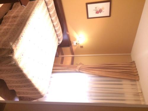 Foto de una habitación de Hotel Nueva Allandesa