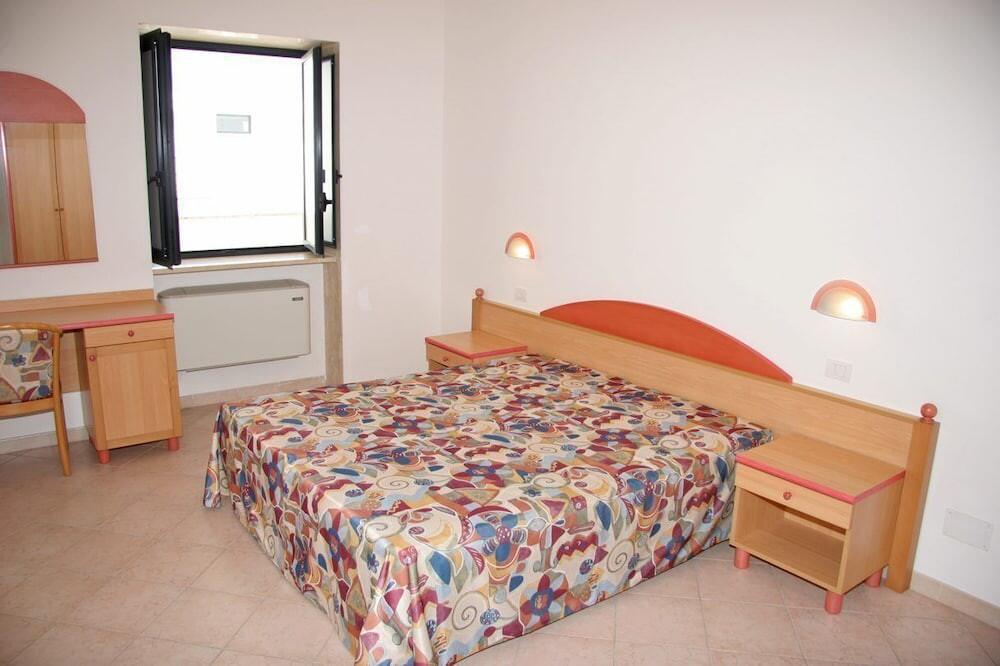Foto de una habitación de Aparthotel Villa Altomare