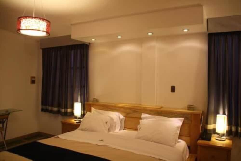 Foto de una habitación de Hotel Villa Jazmin