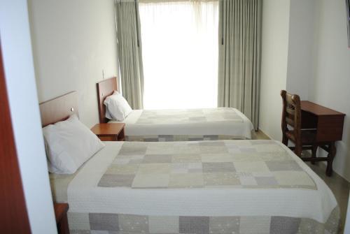 Foto de una habitación de Hotel Hontibon