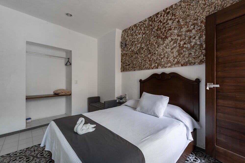 Foto de una habitación de Hotel Colonial Zaci by GuruHotel