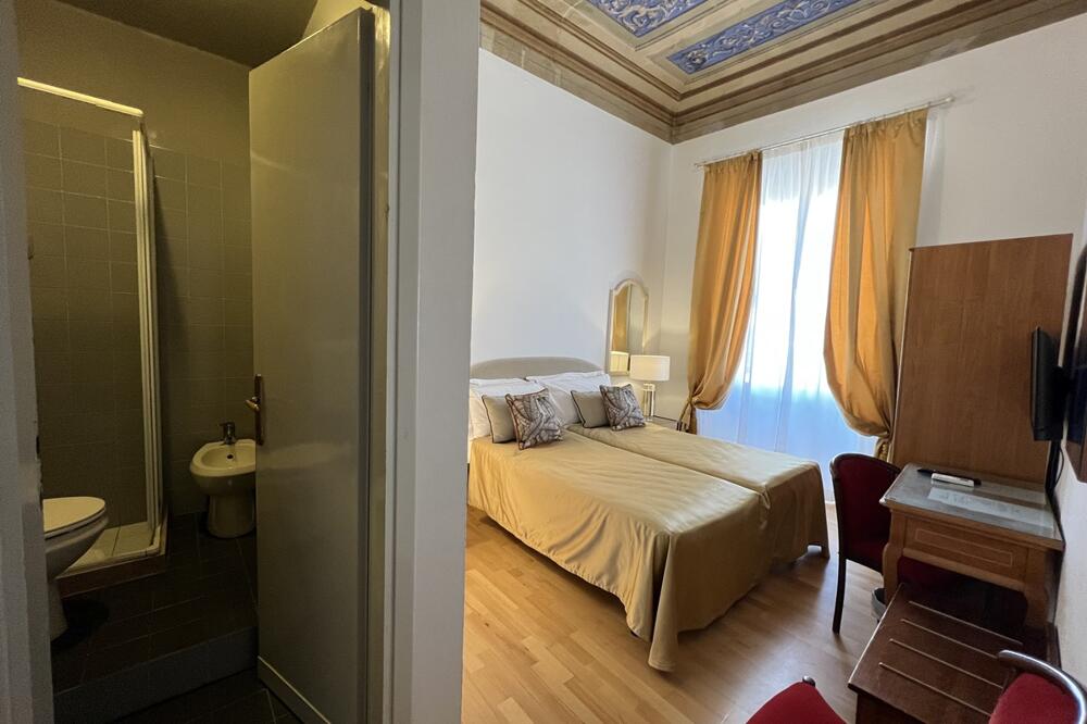 Foto de una habitación de Hotel Villani