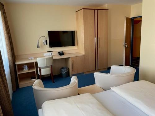 Foto de una habitación de Hotel Apollo Garni